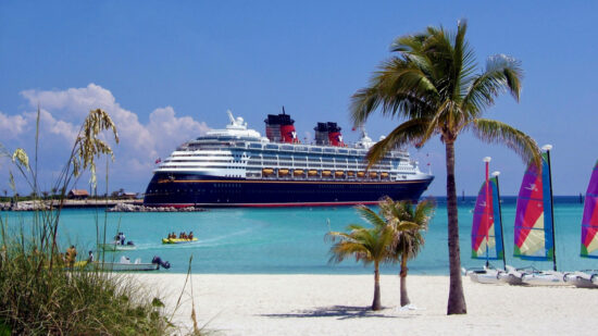 A Disney Cruise ship is docked at Castaway Cay, during a Disney Cruise family vacation