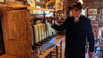 Buffalo Bill look alike Ron Pearce greets visitors at the Buffalo Bill Lodge at Pahaska Teepee, Cody's first