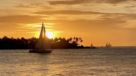 Sailboat in front of sunset in Key West, Florida.