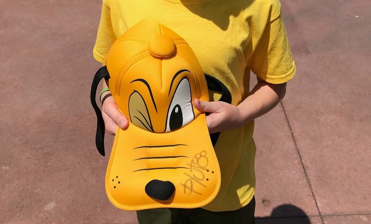 Fun ways to collect character autographs at Disney include using hats!