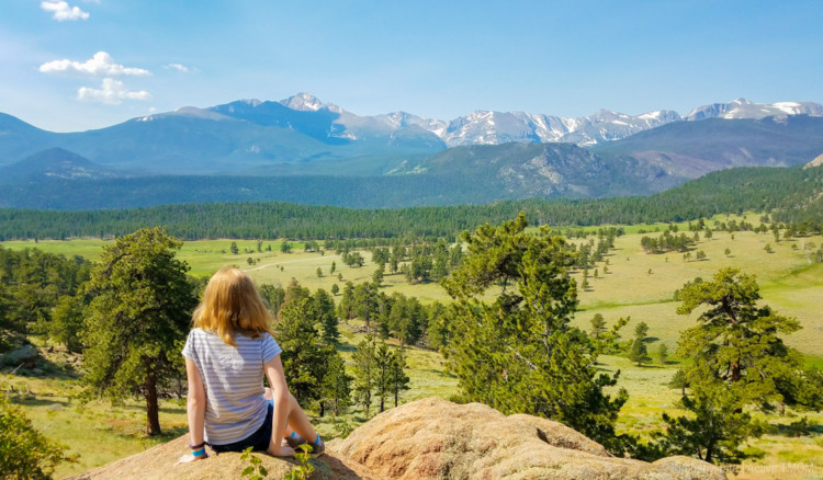 kid overlooking the Rocky Mountains near Estes Park, CO