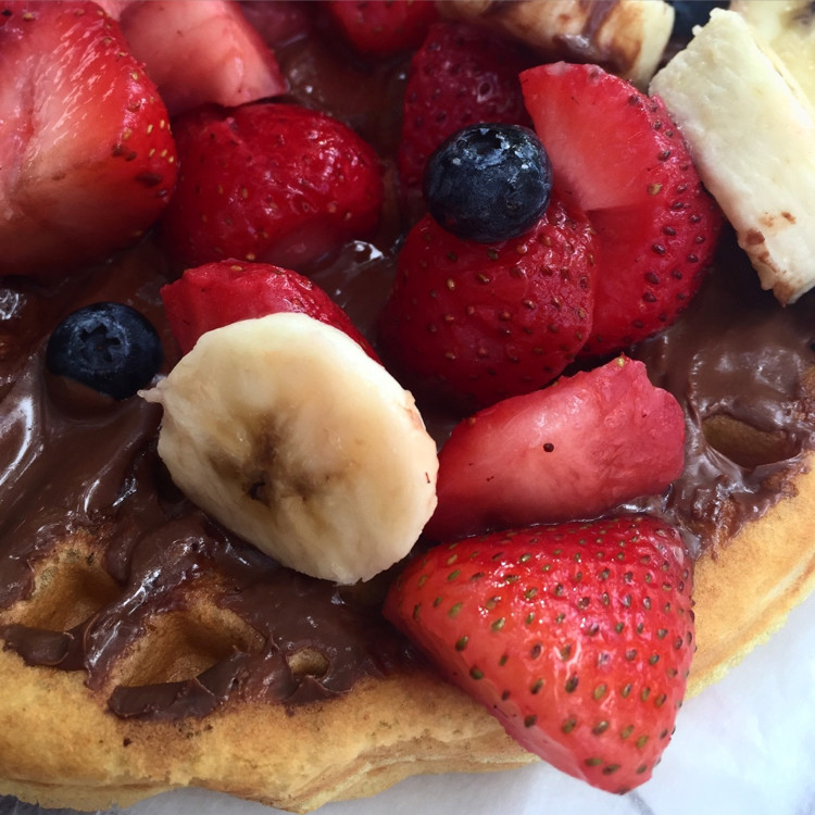 A waffle with Nutella and fruit is one of the great magic kingdom snacks, and one of the best uses of snack credits on the Disney Dining Plan.