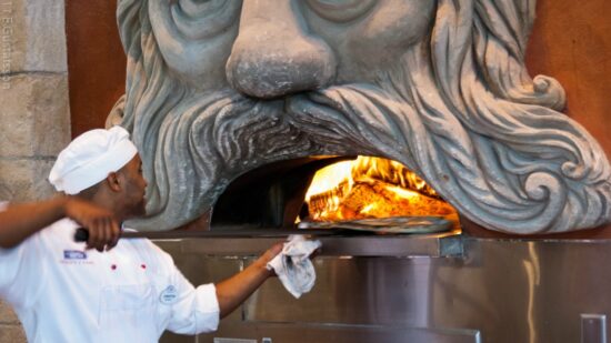 Pizza in giant wood fired ovens being prepared at Via Napoli a very excellent Italian restaurant that you can find in Italy - EPCOT - Photo Creative Commons