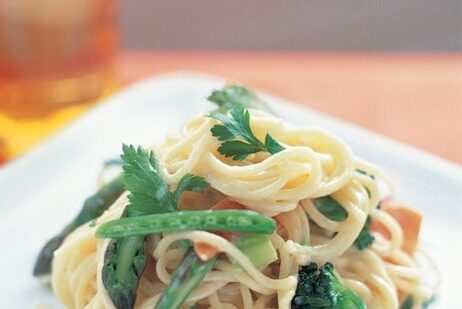 creamy pasta primavera with angel hair and vegetables